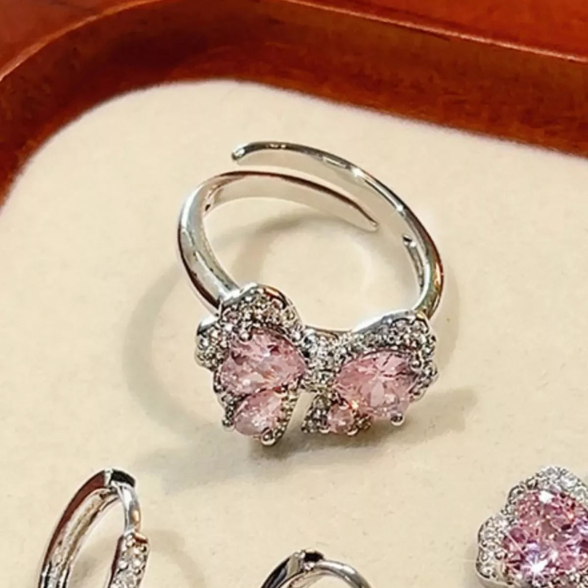 Copper Zircon Bow Bypass Ring Pink Zircon Accents