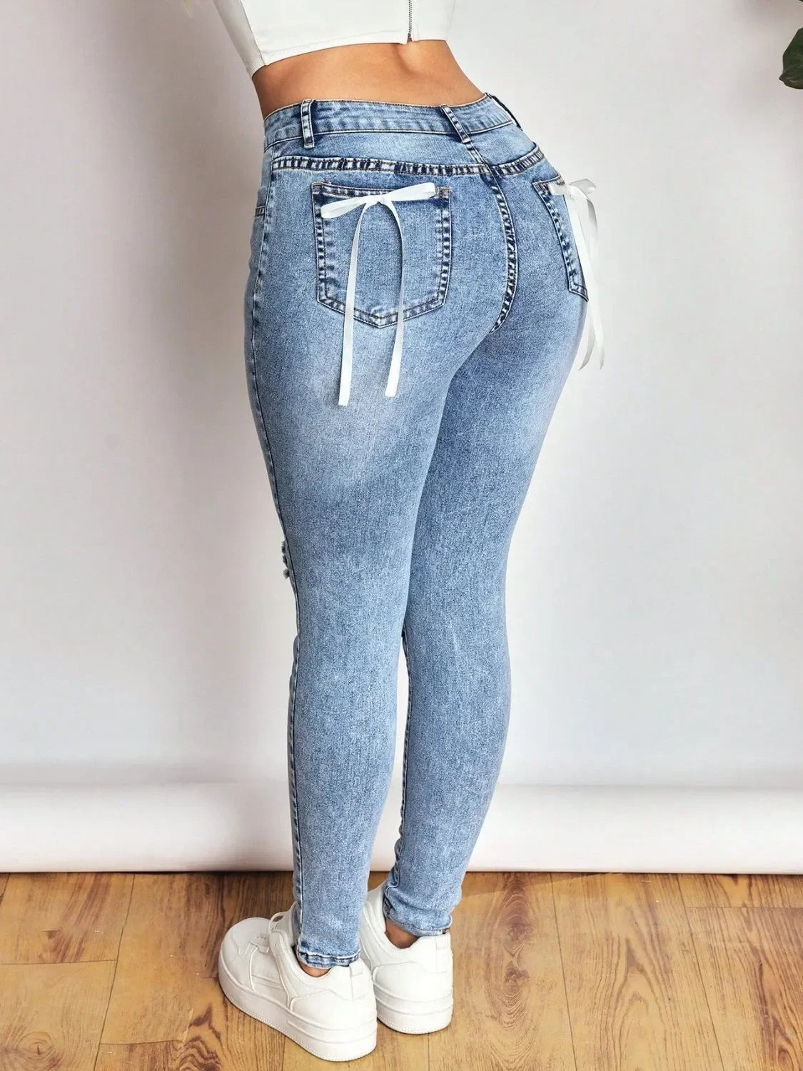 Coastal Distressed Stretch Skinny Jeans With Bow Back Design - Southern Shores Clothing